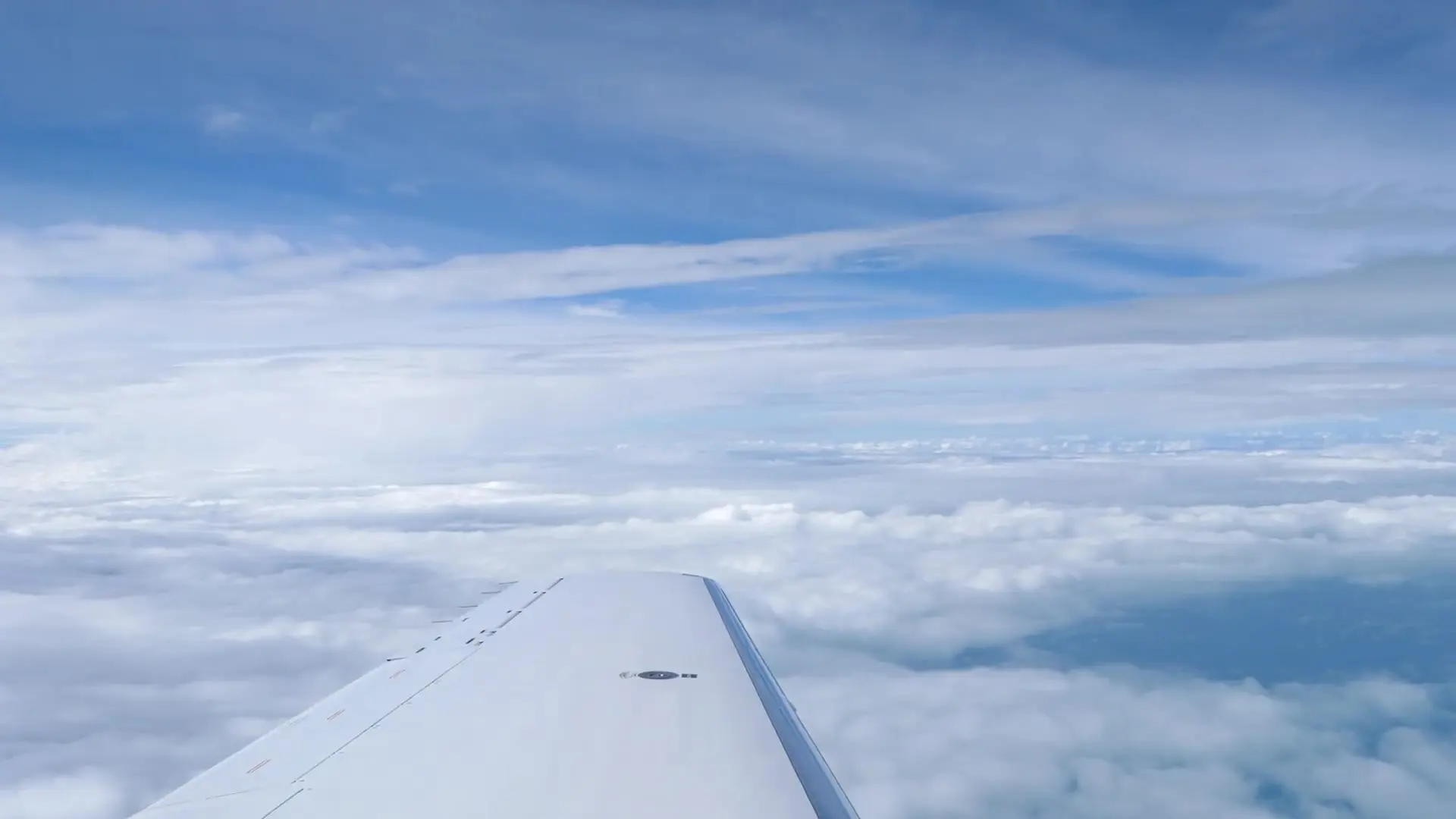 Business jet above a sea of golden clouds